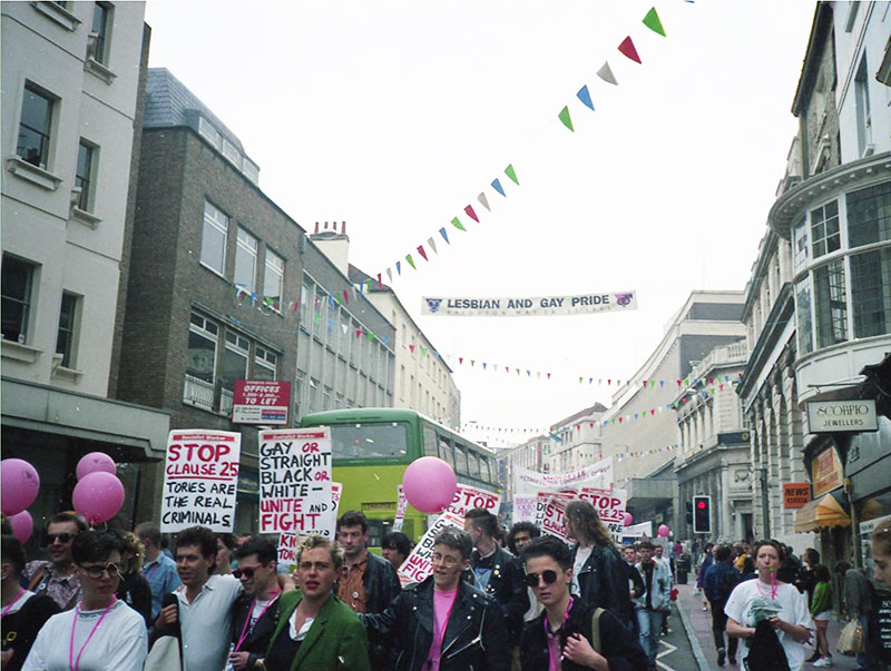 People with placards marching through Brighton