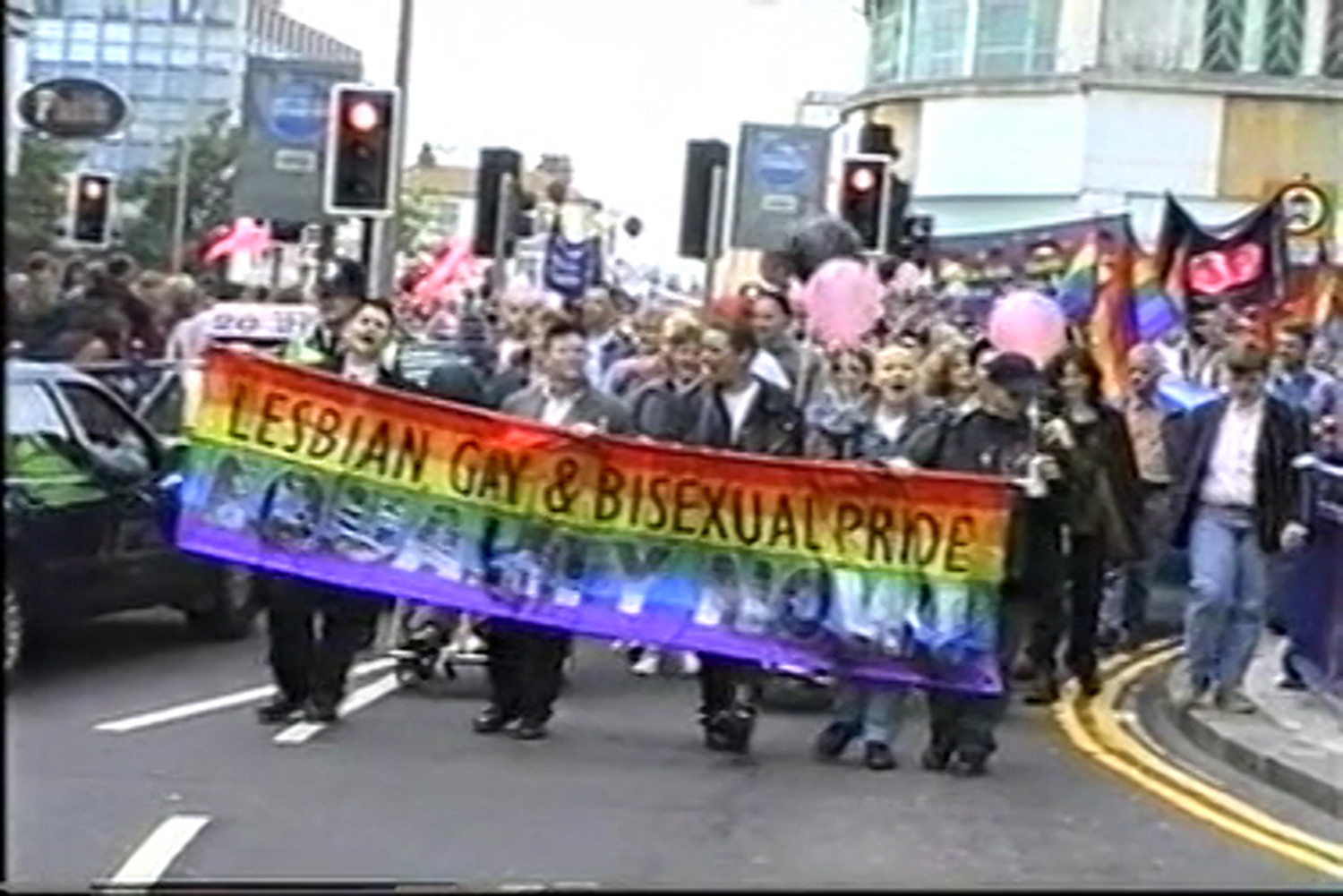 People with a banner: Lesbian, Gay & Bisexual Pride