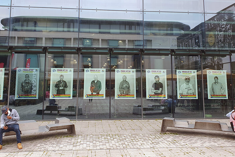 Portraits of Sussex GLF in large windows of Jubilee Library