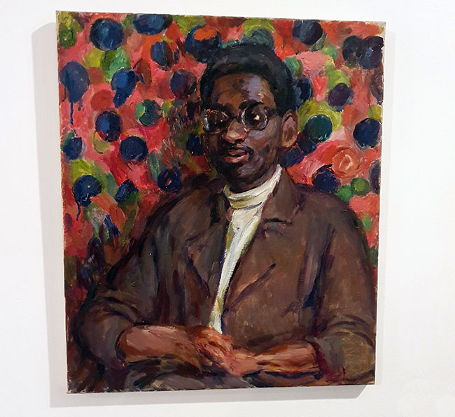 Portrait of a black man with a colourful spotty background - Tony Haynes