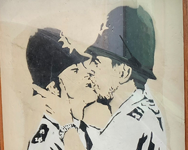 Graffiti showing two policeman kissing