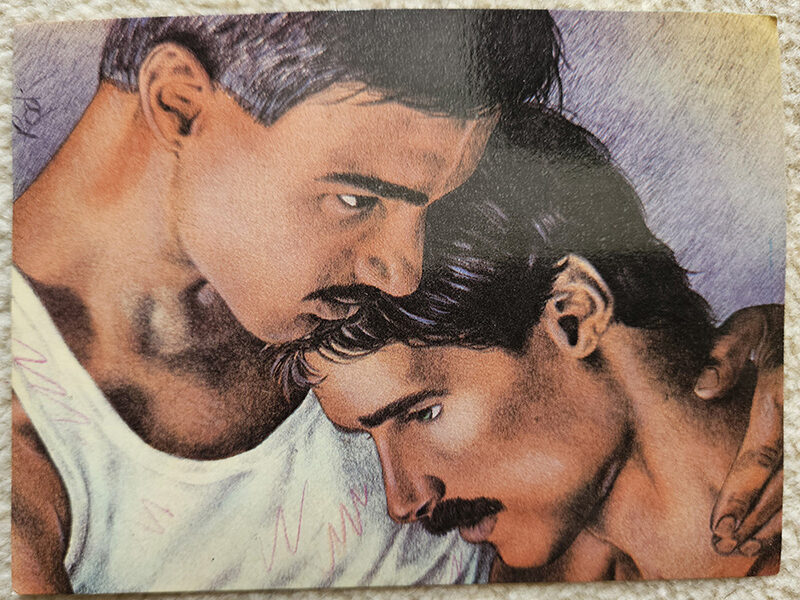 One man resting his head against another's chest